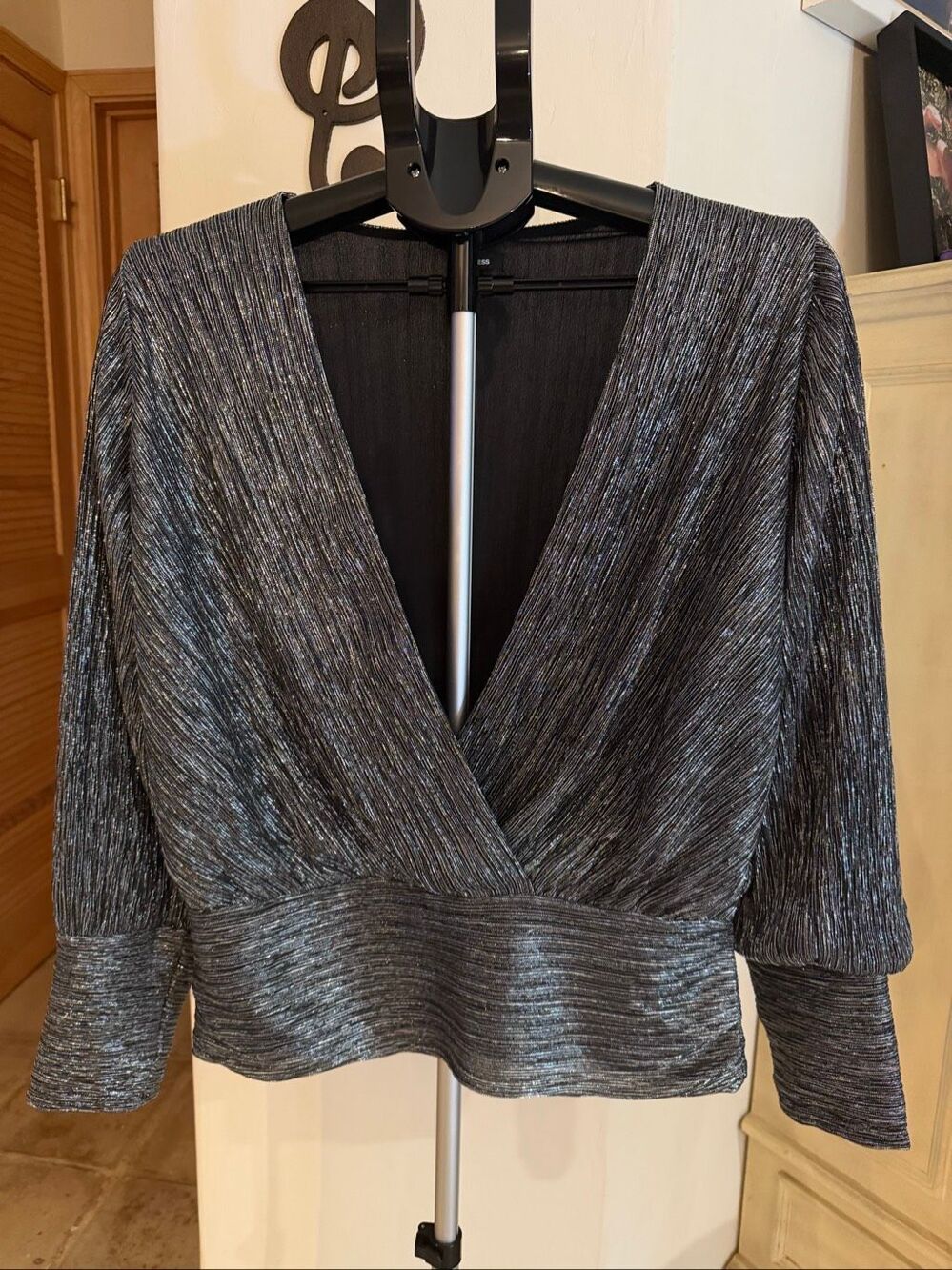 Express metal, metallic, silver, and black V-neck top